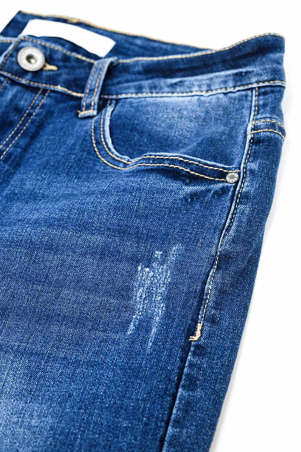 Calças de ganga super skinny em lavagem média com rasgões na parte inferior