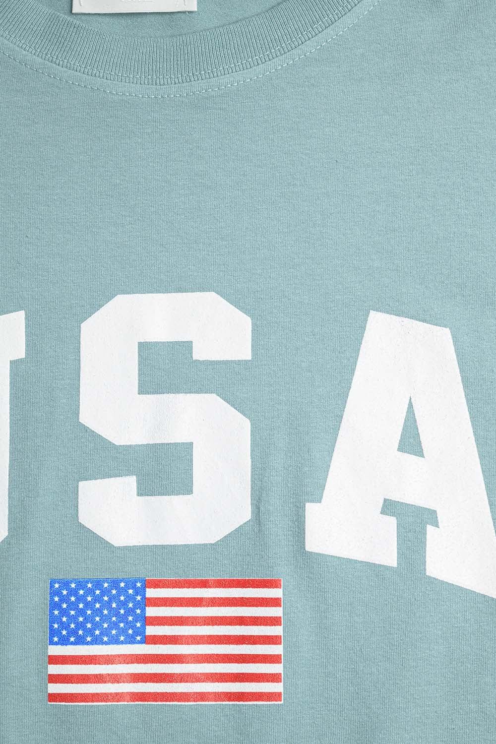 Camiseta longa solta verde com logotipo dos USA