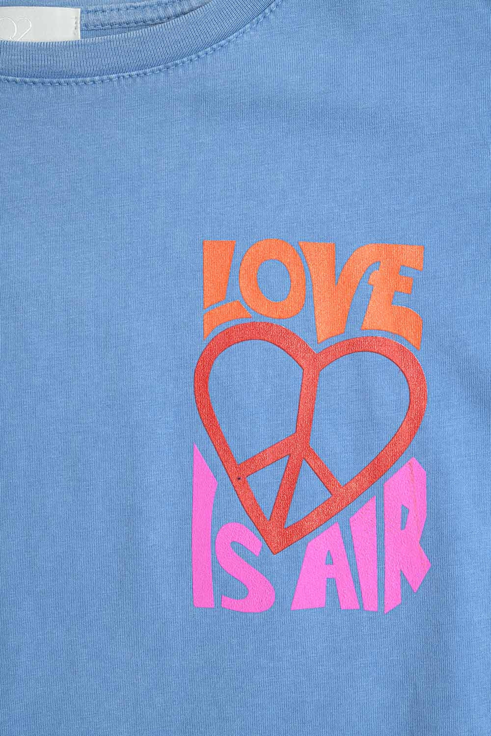 T-Shirt azul fabricada em Itália com o logótipo Love is Air e Heart with Peace