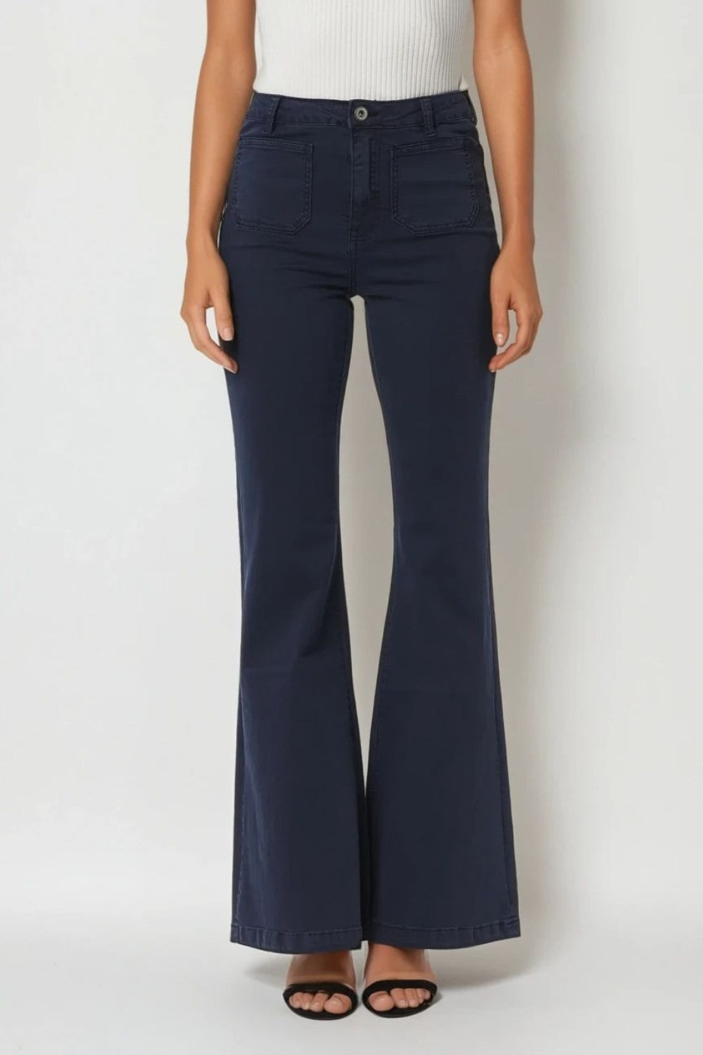 Calças de ganga skinny com pormenor de bolso à frente