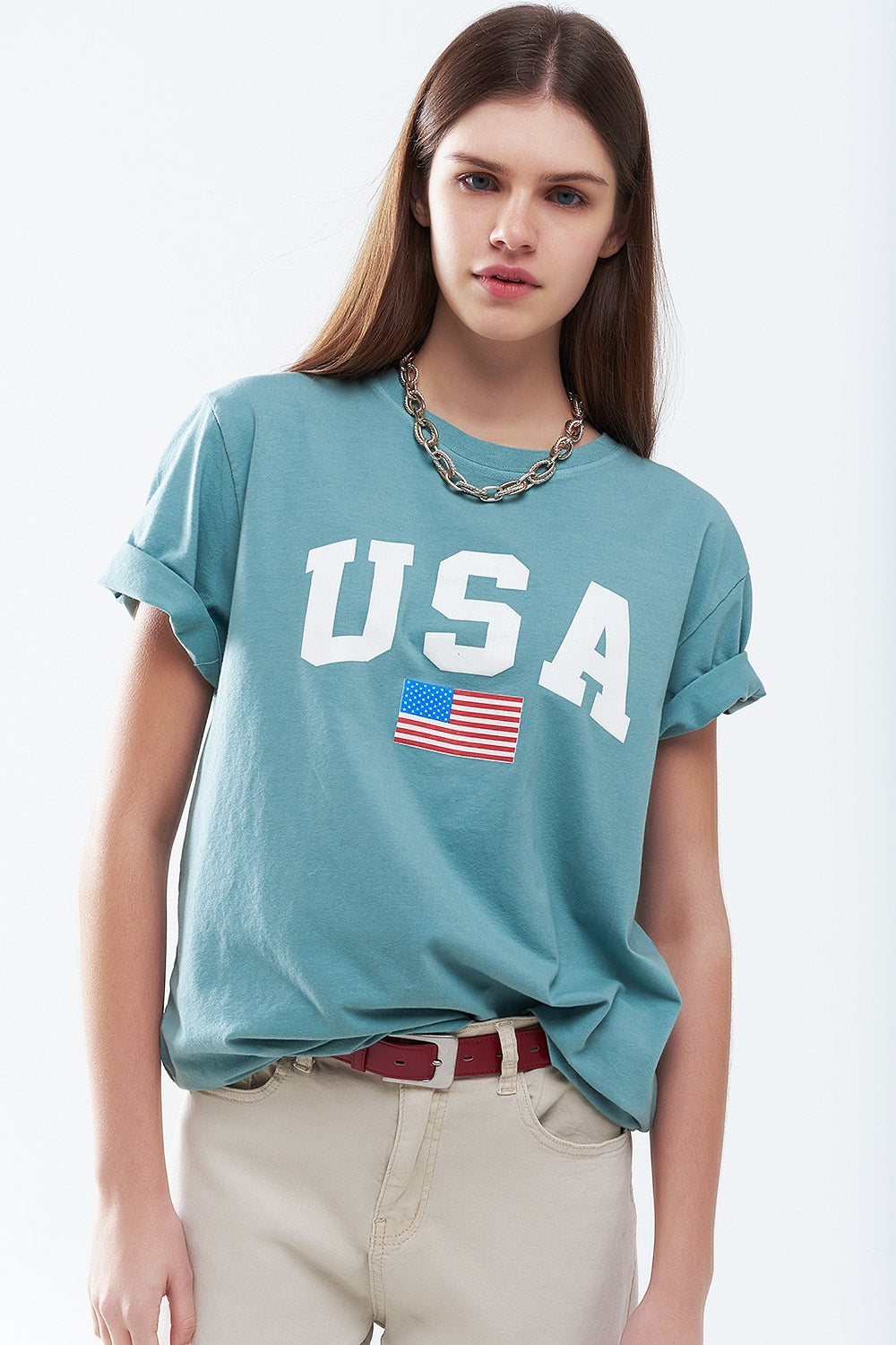 Camiseta longa solta verde com logotipo dos USA