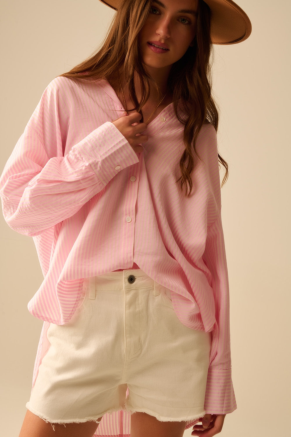 camisa rosa bebé de grandes dimensões com laço nas costas