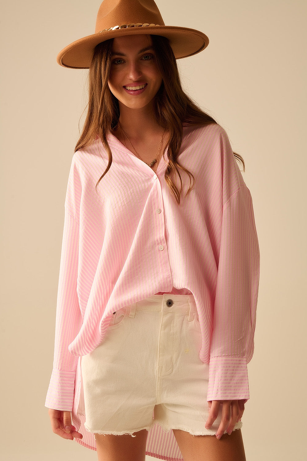 camisa rosa bebé de grandes dimensões com laço nas costas