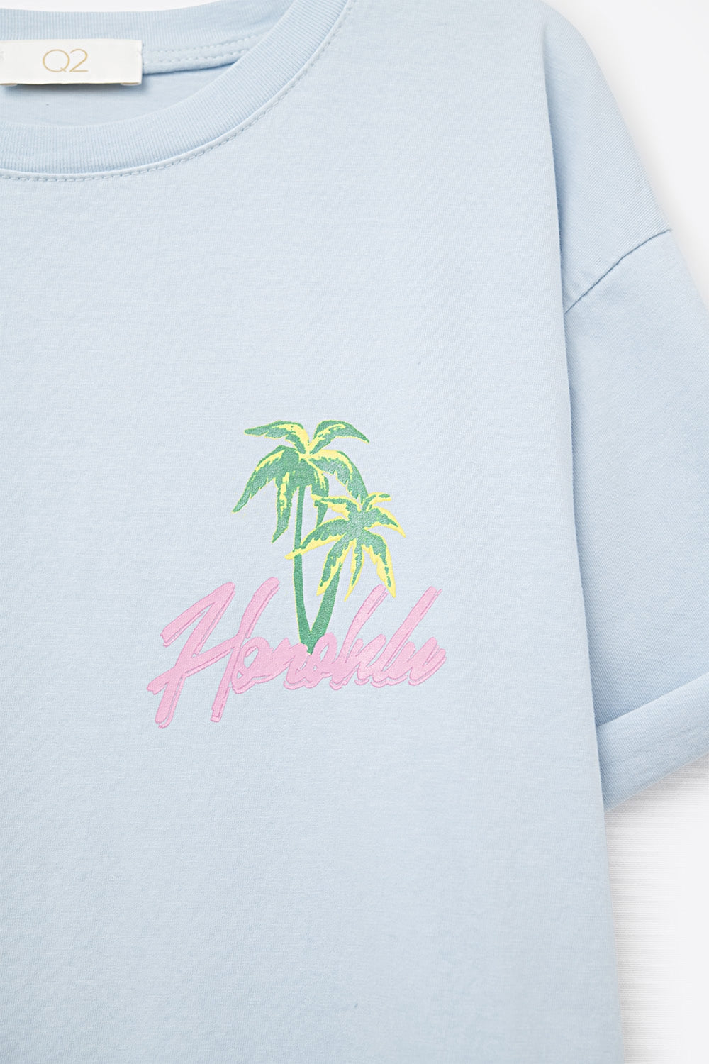 T-shirt azul fabricada em Itália com gráfico de Honolulu