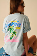 T-shirt azul fabricada em Itália com gráfico de Honolulu