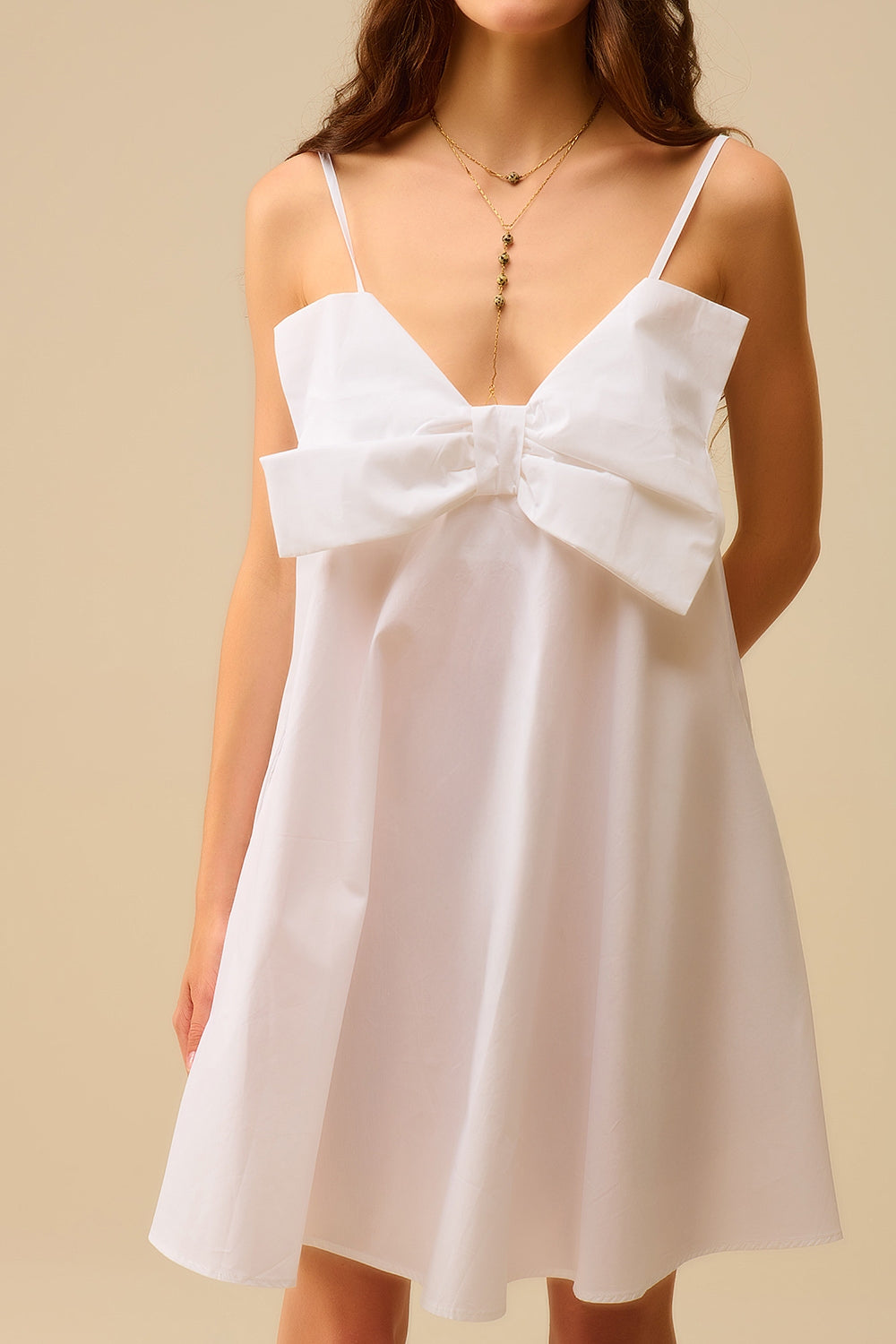Minivestido de popelina branca com um grande laço
