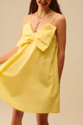 Minivestido de popelina amarelo com um grande laço