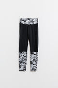 Leggings pretas com cintura e bainhas com estampado de mármore