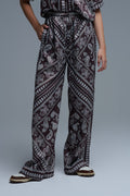 Calças relaxadas com estampado Paisley e cordão ajustável em castanho