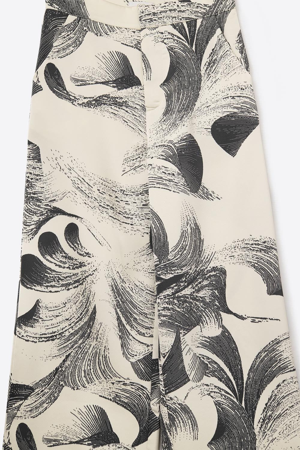 Calças largas em creme com estampado elegante