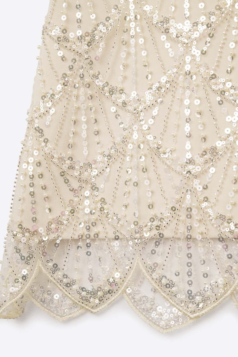 Top com lantejoulas em creme