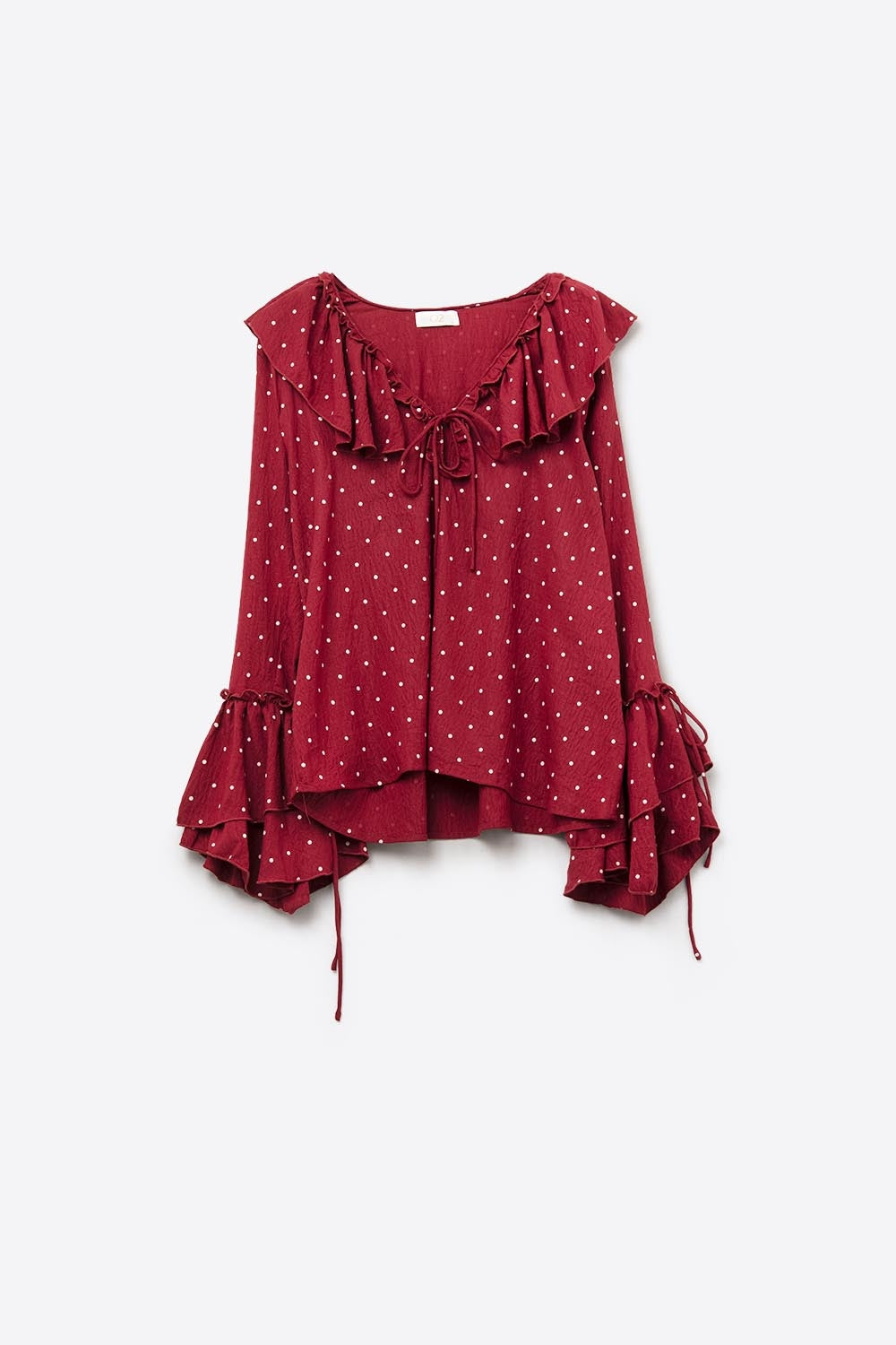Blusa vermelha às bolinhas com folhos e mangas largas