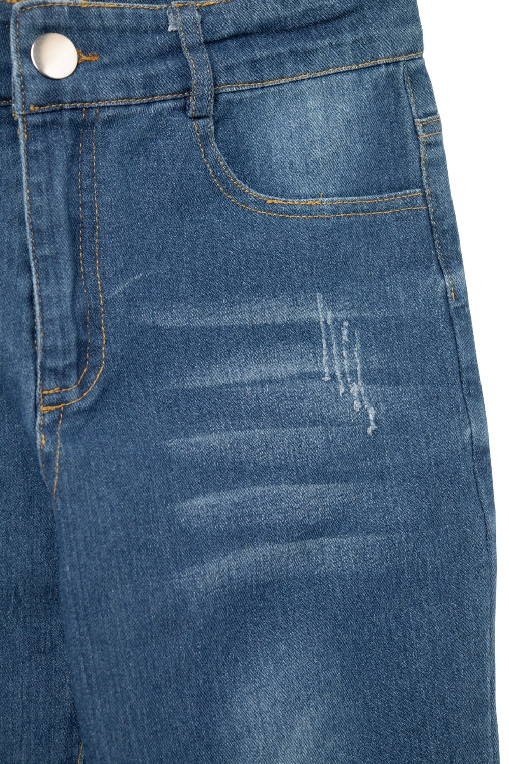Calças de ganga skinny desgastadas em lavagem média com rebordo em bruto