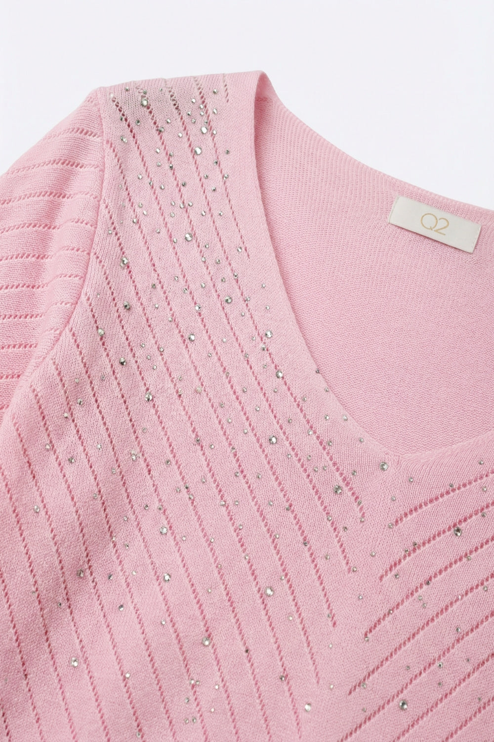 Camisola de malha leve com decote em V rosa e pormenores de missangas