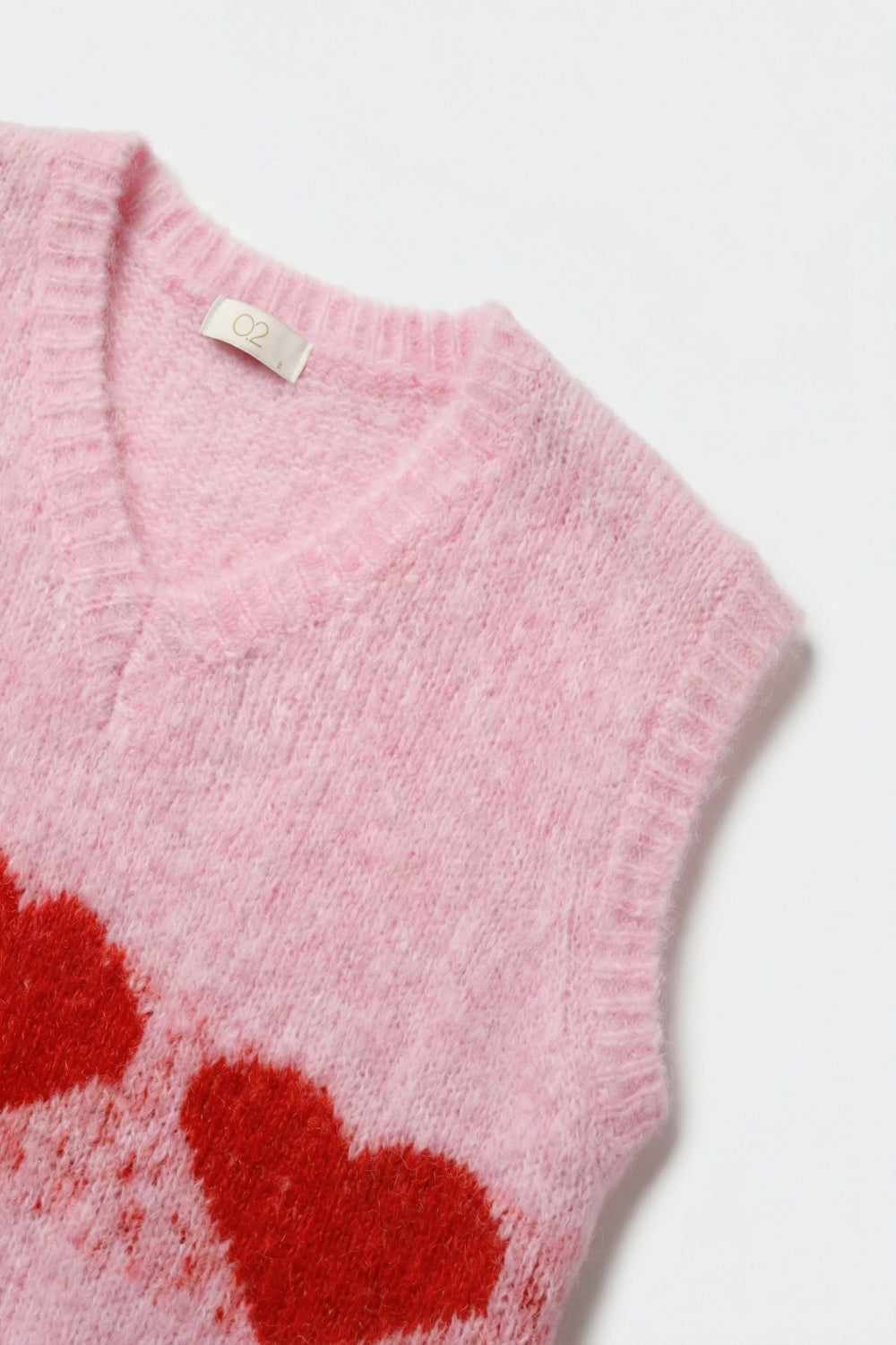 Colete de malha fofo e descontraído cor-de-rosa com motivos em forma de coração