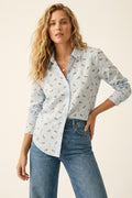 Camisa com botões azul clara com estampado de cão
