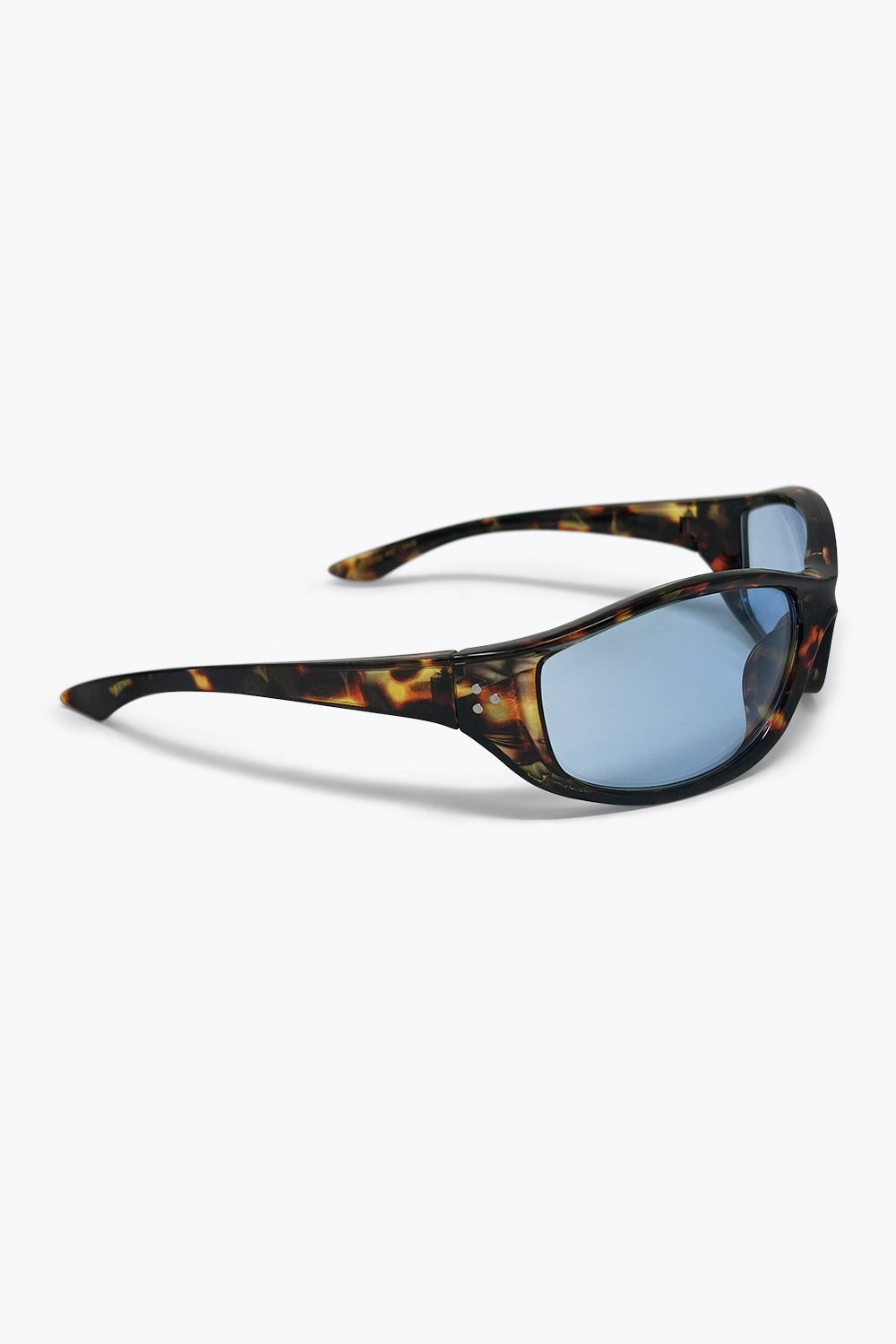 Armação multicolorida de casco de tartaruga com lentes ovais azuladas