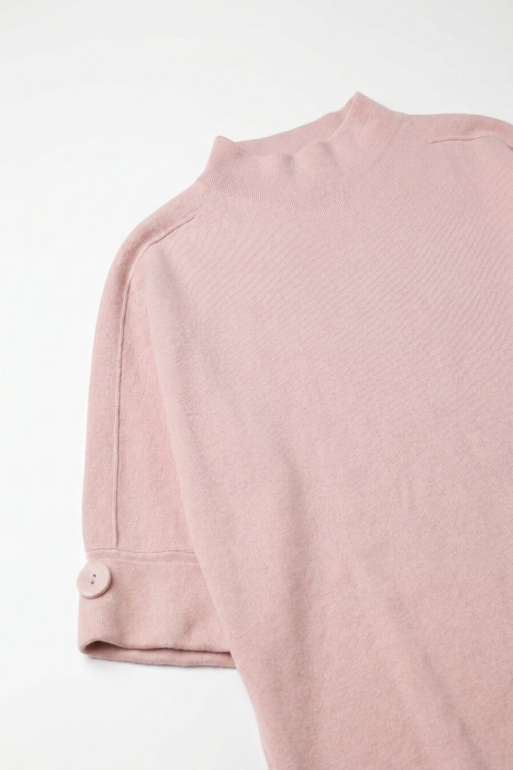 Camisola de malha rosa com pormenores de botões