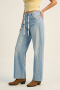 Calças Jeans Relaxadas Ajustáveis em Azul Claro