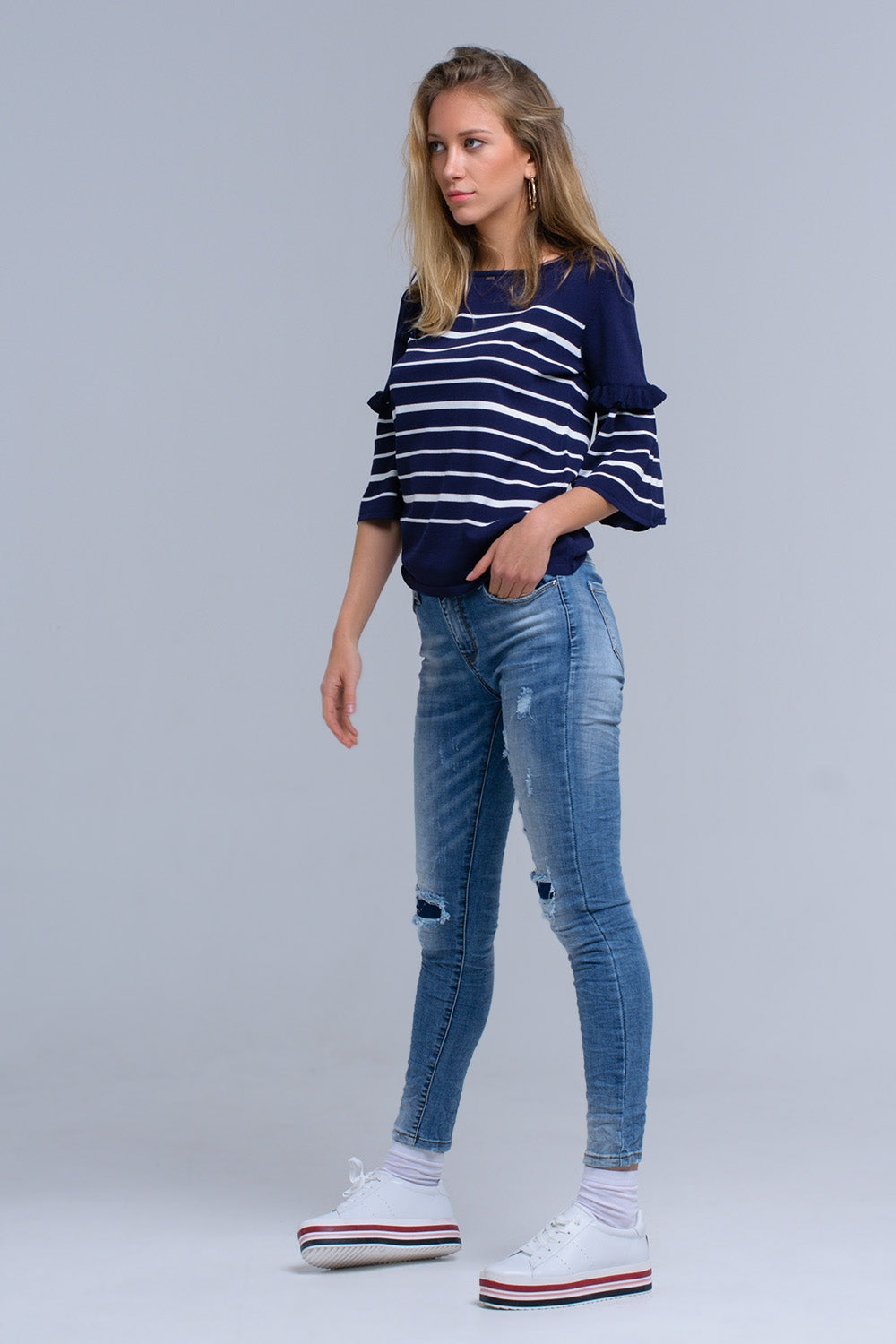 Calças jeans skinny com rips