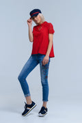 Calças jeans magras com flores pintadas