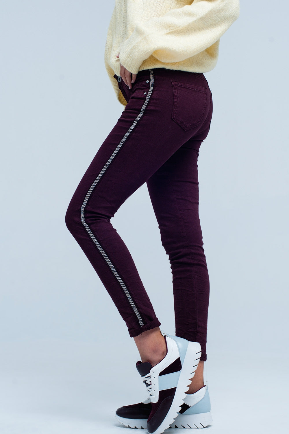 Calças de ganga skinny com listra lateral de metal