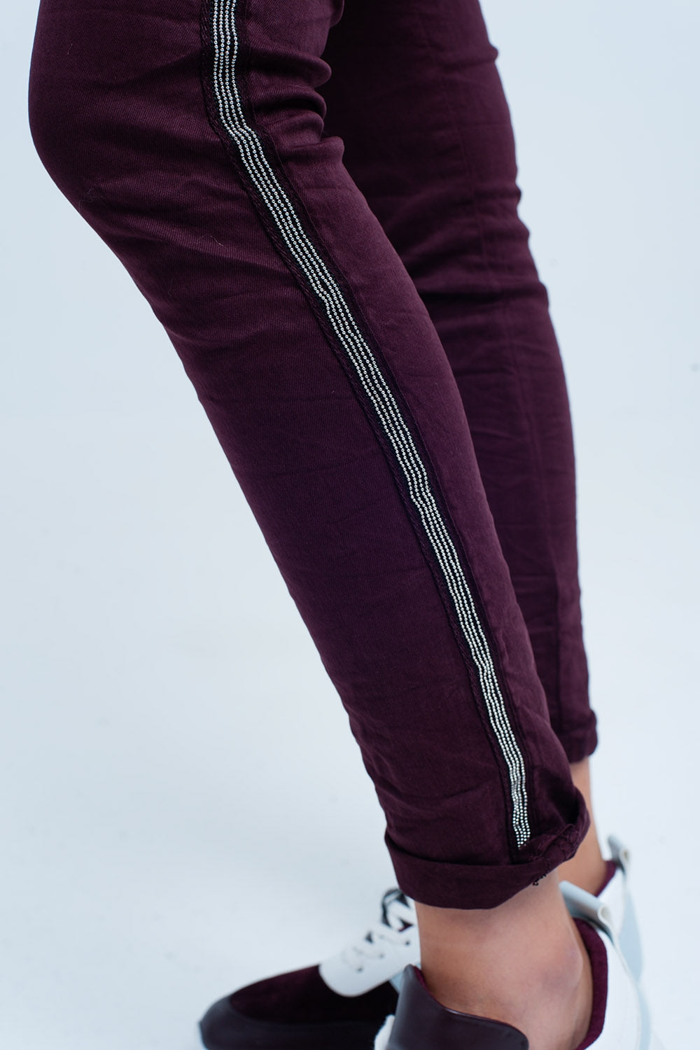 Calças de ganga skinny com listra lateral de metal