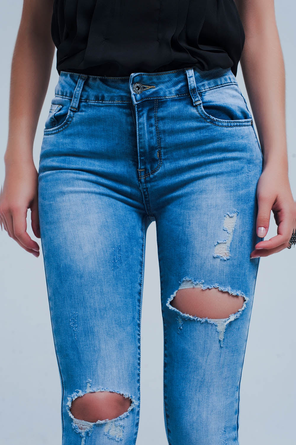 Calças de ganga skinny com efeito desgastado