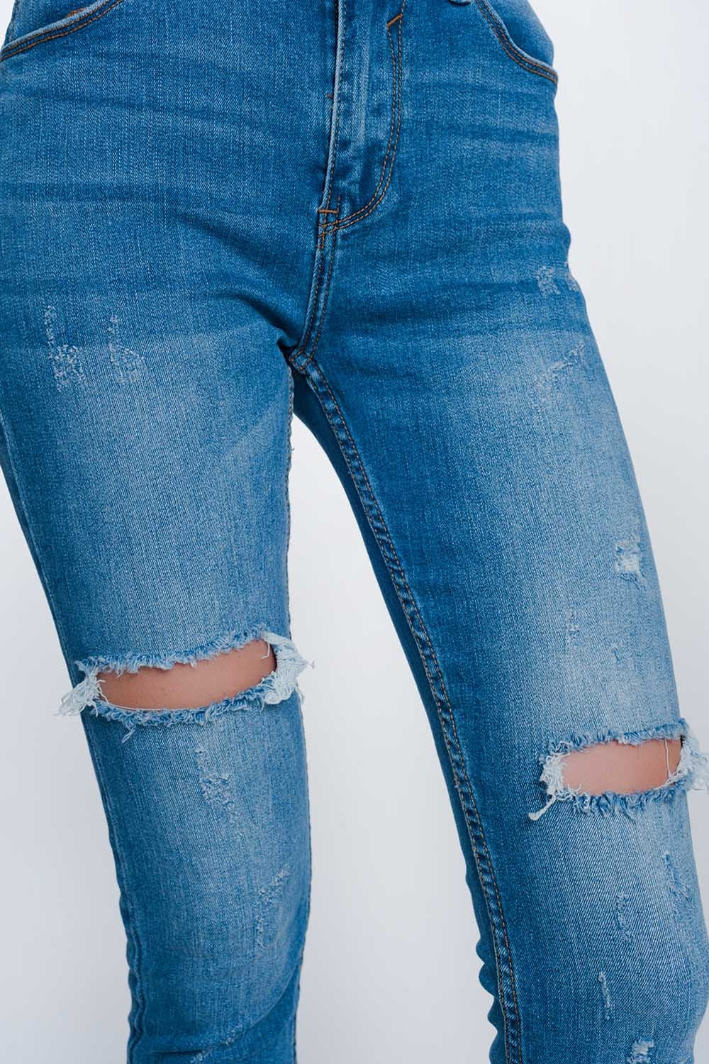 Calças de ganga super skinny com buracos nos joelhos