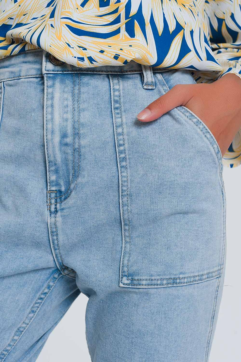 Jeans com bolsos ovóides azuis