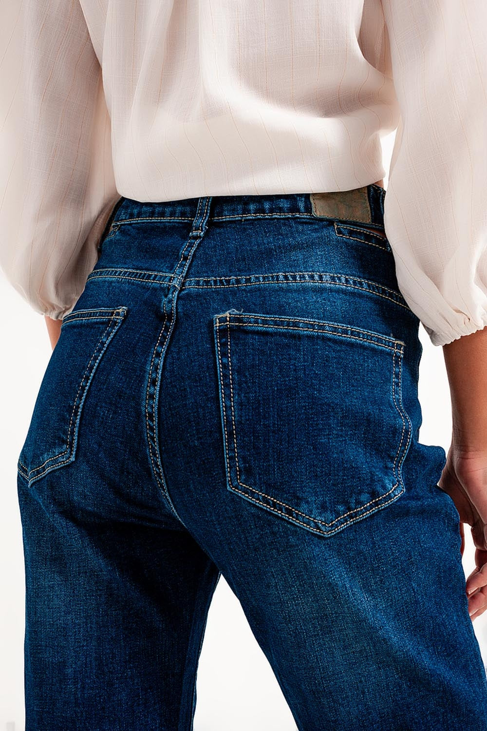 Calças de ganga cut out slim com uma cintura alta em azul