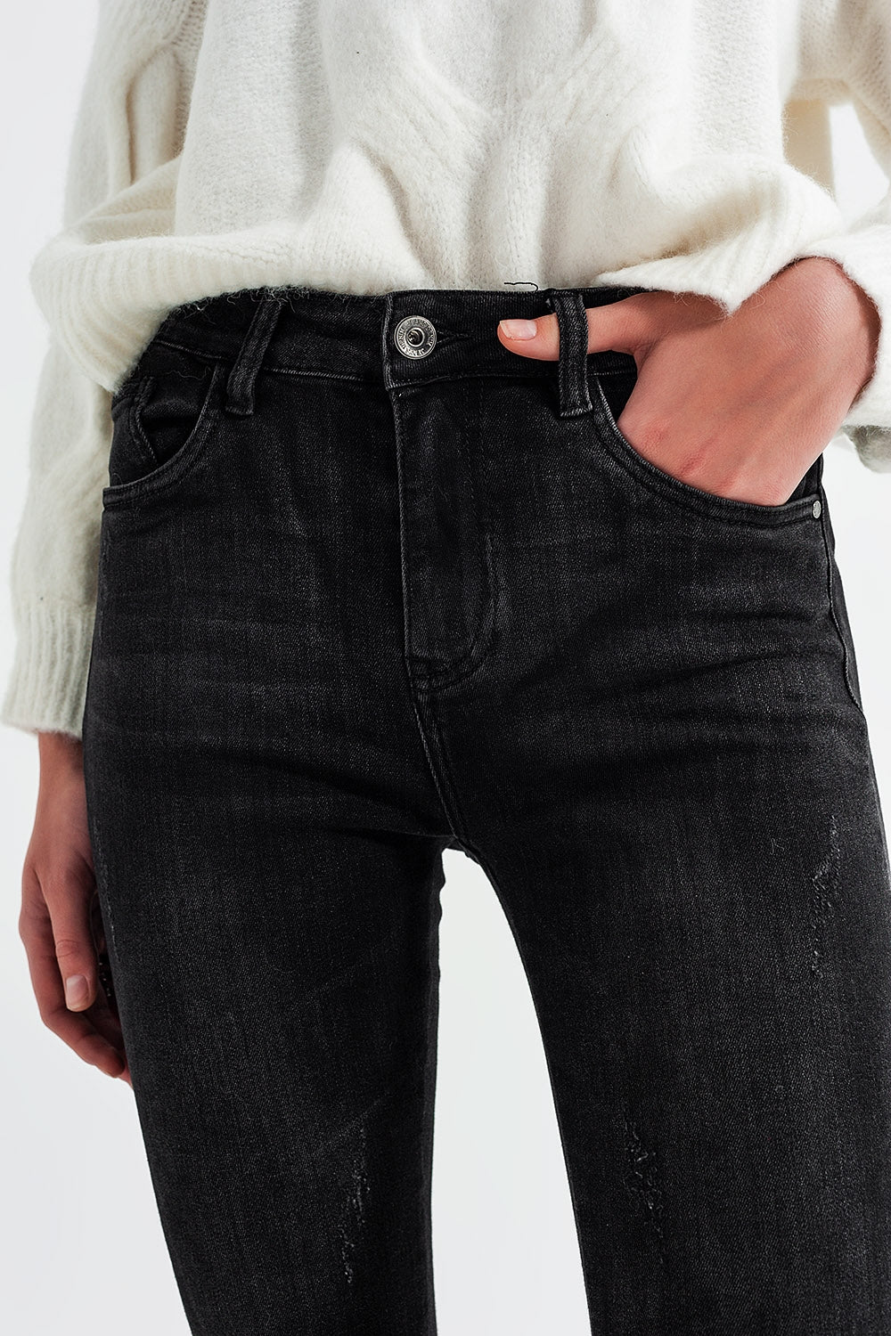 Calças de ganga skinny de lavagem preta e fecho nas bainhas