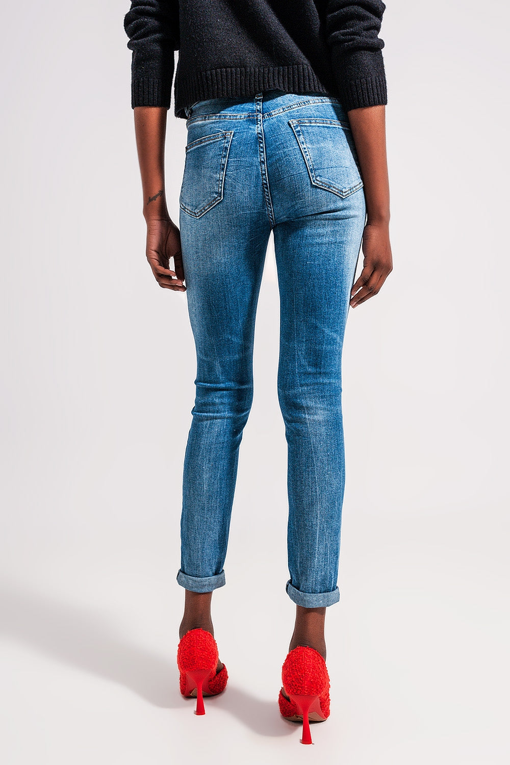Calças de ganga médias azuis skinny de algodão elastico