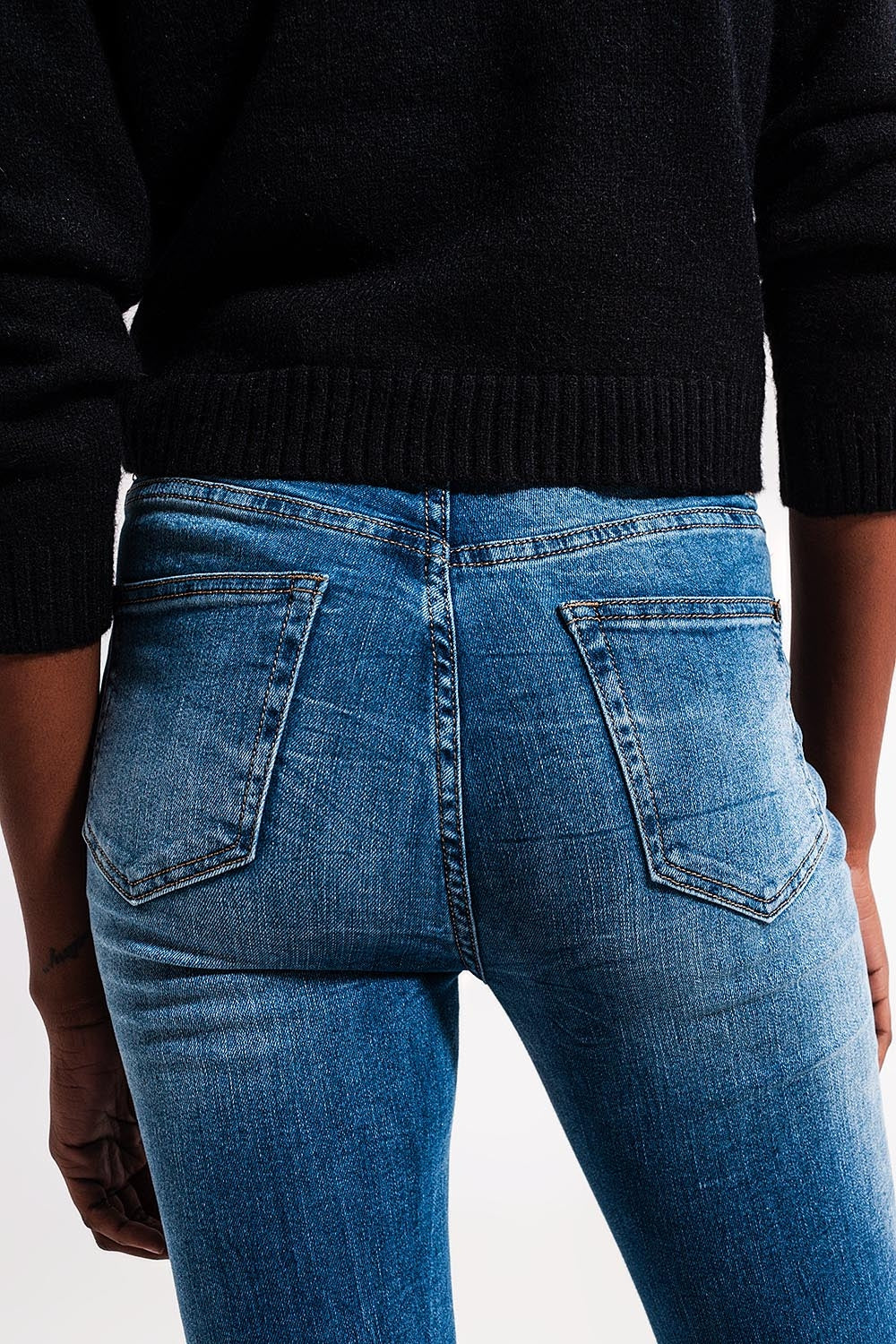 Calças de ganga médias azuis skinny de algodão elastico