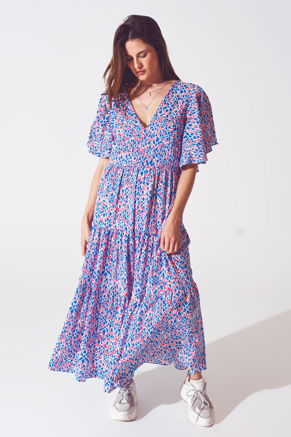 Vestido longo com costas abertas e laço na estampa roxa