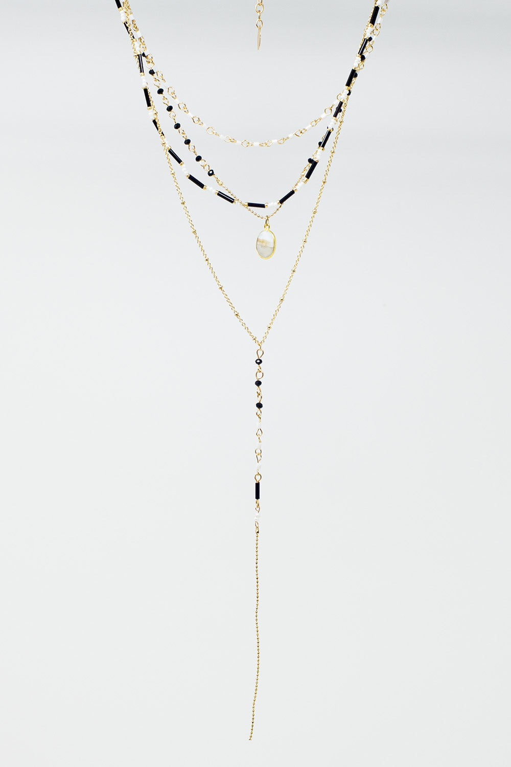 Colar 4 em 1 dourado com contas pretas e brancas