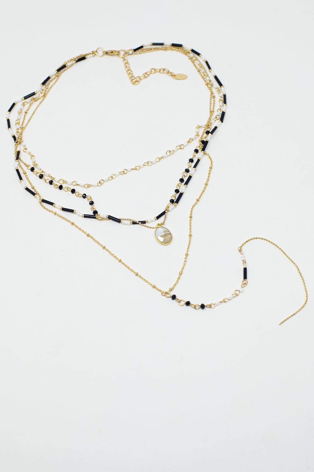 Colar 4 em 1 dourado com contas pretas e brancas