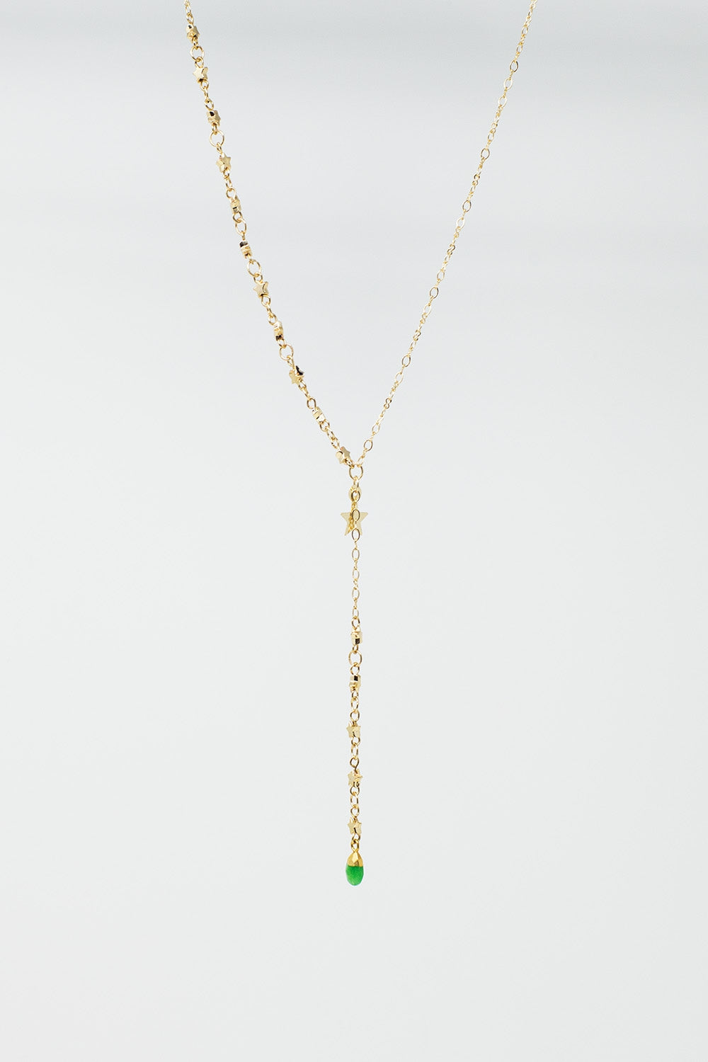 Colar dourado com estrela e pérola verde