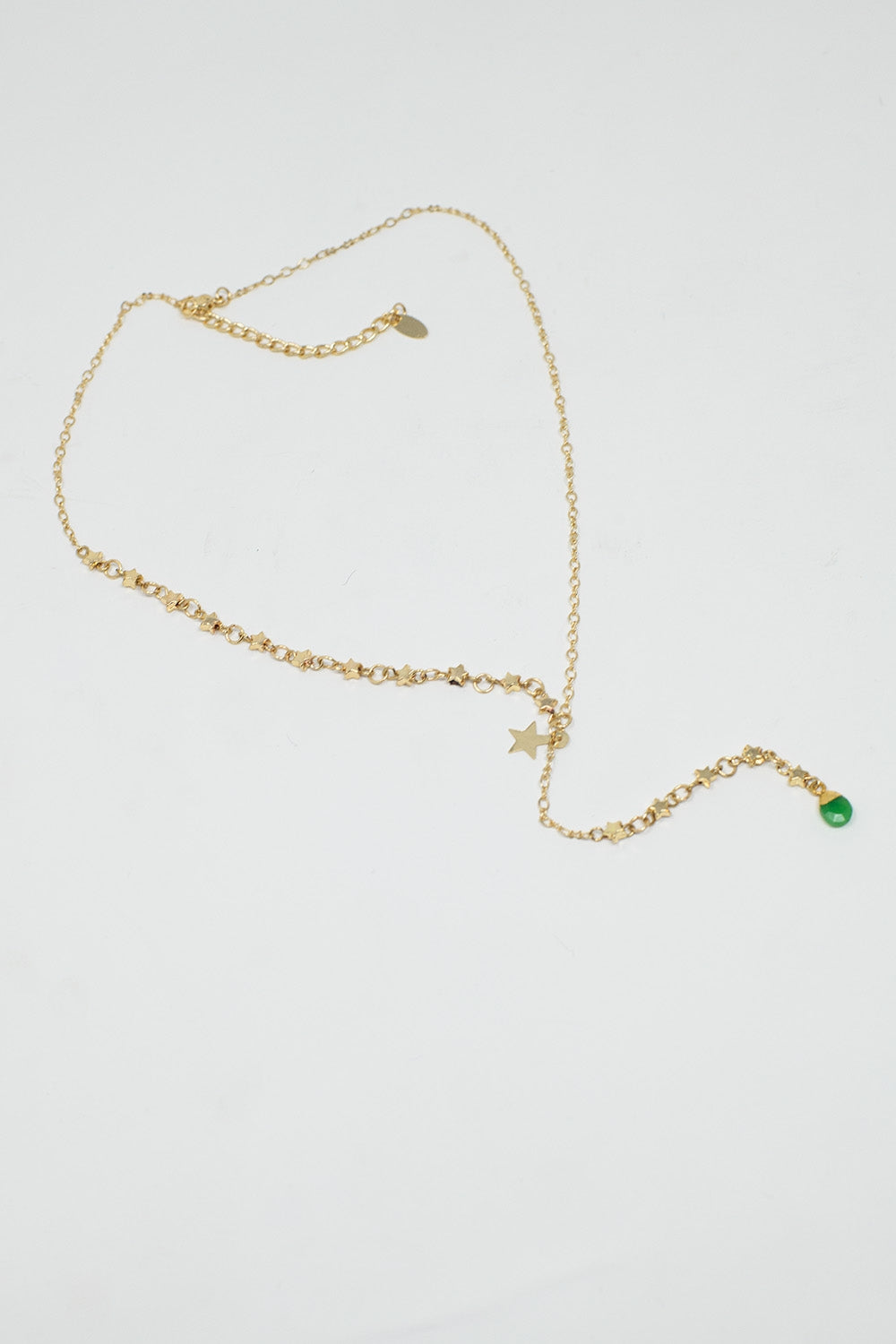 Colar dourado com estrela e pérola verde