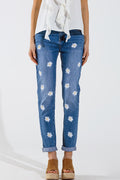 Calças de ganga skinny com margaridas brancas estampadas em lavagem média