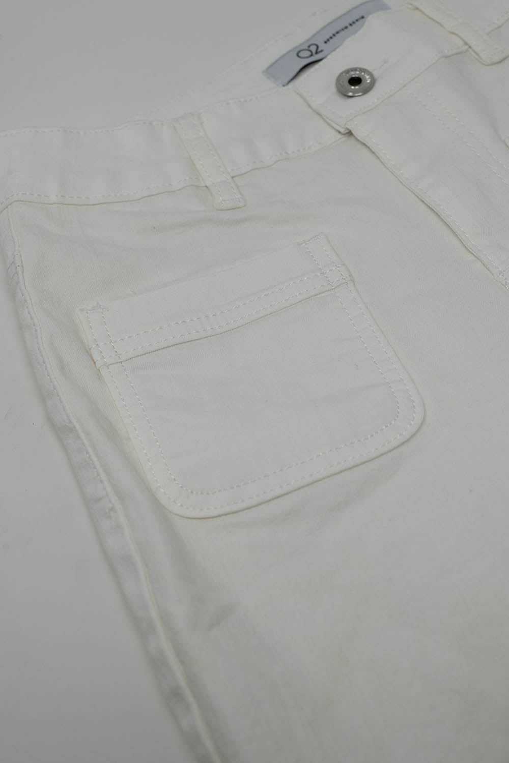 Calças de ganga skinny brancas com pormenor de bolso à frente