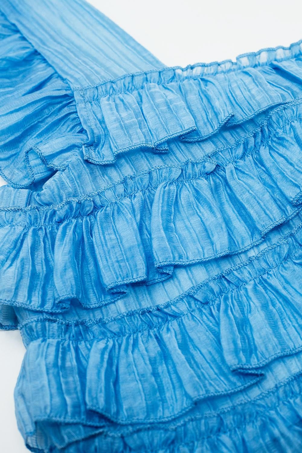 Top sem mangas azul com design com pregas
