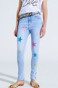Calças de ganga skinny de lavagem clara com estrelas nas pernas