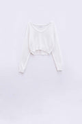 Camisola creme com decote em V largo e pormenores entrançados