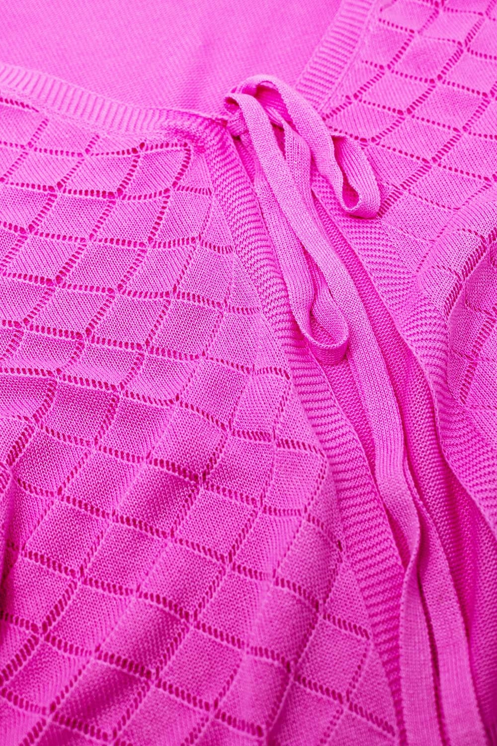 Casaco de malha cor-de-rosa com estampado Argyle e fecho com laço