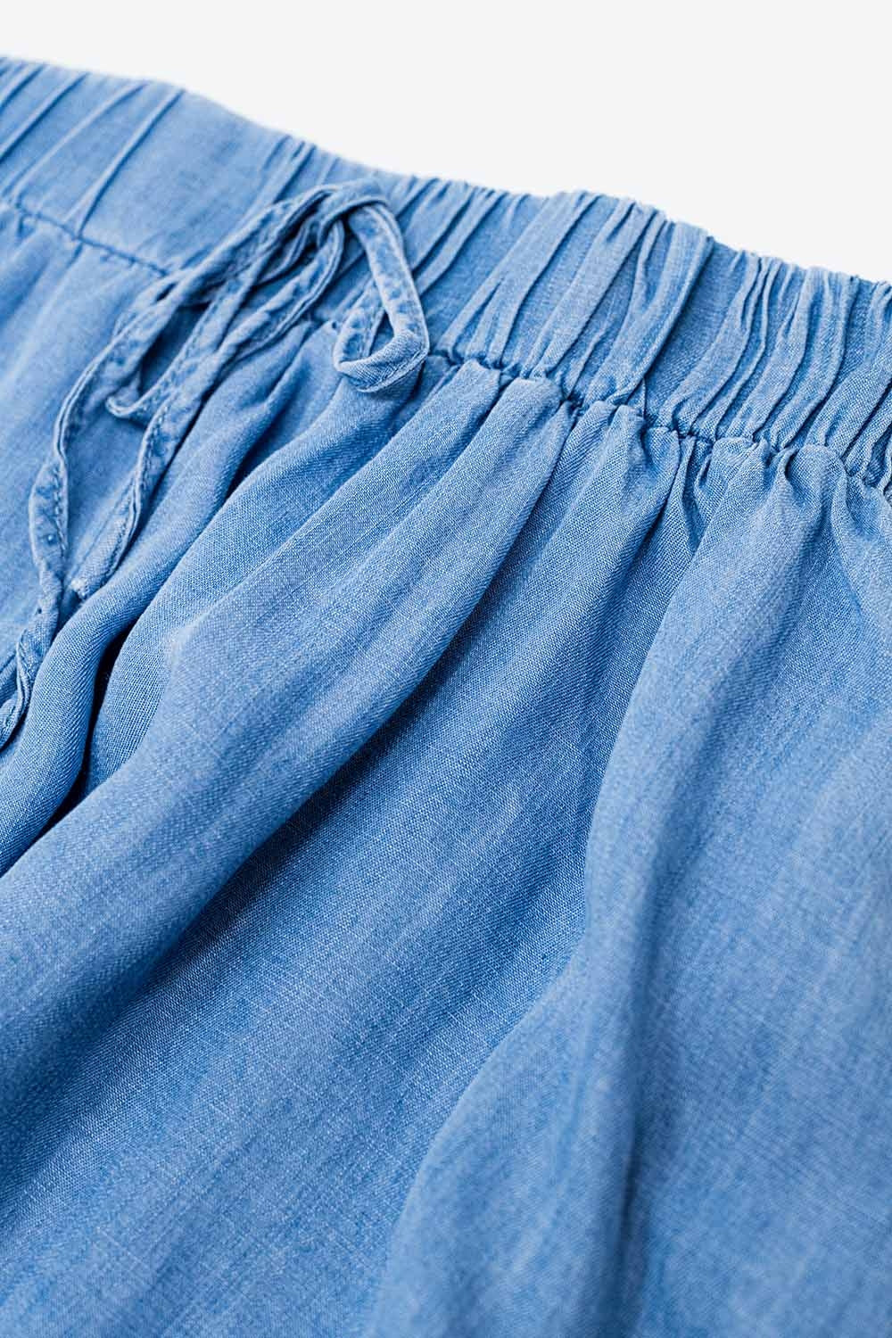 Calções em Tencel de ganga esvoaçantes com bolsos laterais